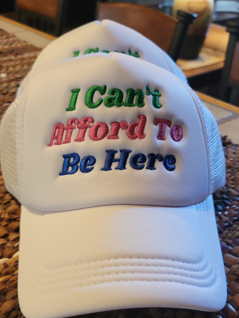 White Trucker Hat with Colorful Embroidered Slogan - I Can't Afford To Be Here